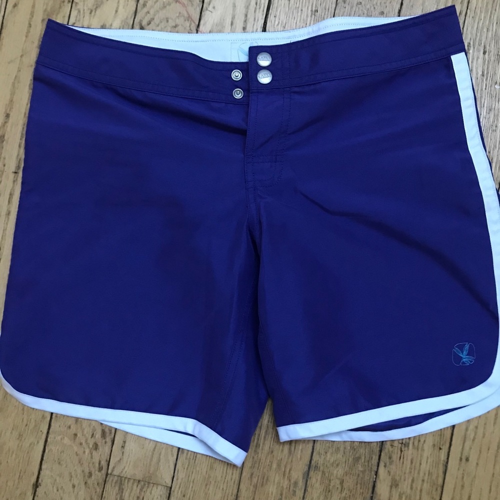 Bright purple carve designs board shorts